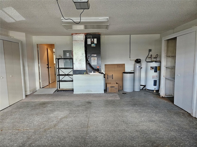 garage with electric water heater and a garage door opener