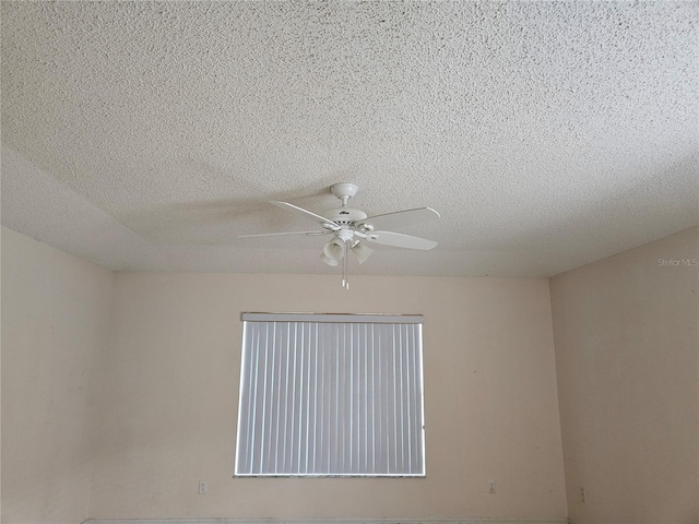 room details with a textured ceiling and ceiling fan