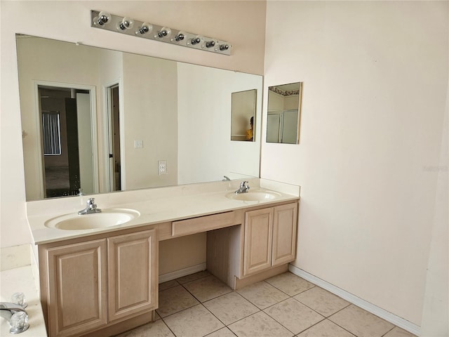 bathroom with tile patterned flooring and vanity