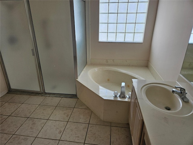 bathroom with separate shower and tub, tile patterned flooring, and vanity