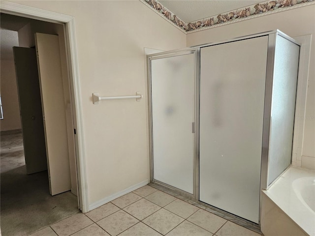 bathroom featuring shower with separate bathtub and tile patterned floors