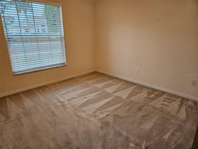 empty room with carpet flooring