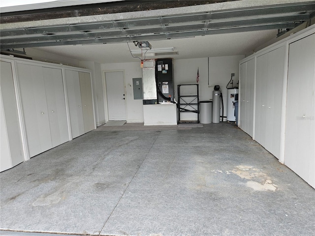 garage featuring electric panel, electric water heater, heating unit, and a garage door opener