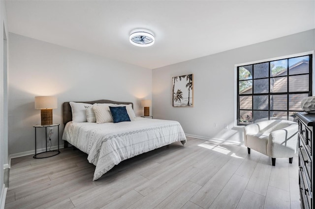 bedroom with light wood-type flooring