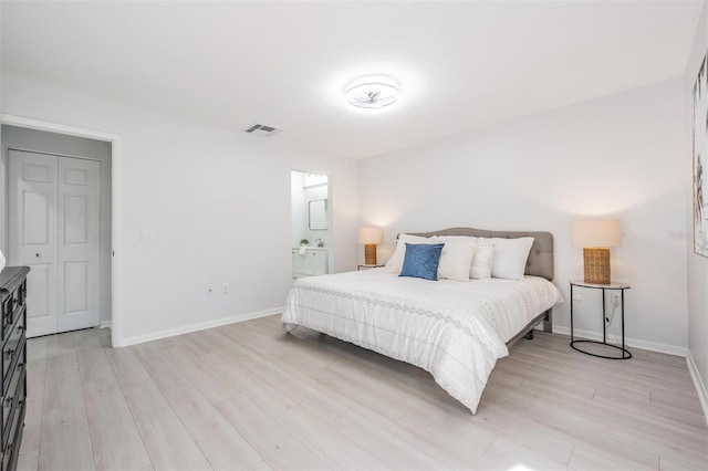 bedroom featuring light wood-type flooring