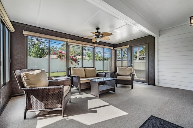 sunroom / solarium featuring ceiling fan