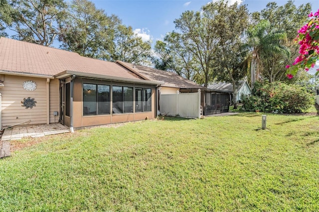 view of yard with a sunroom