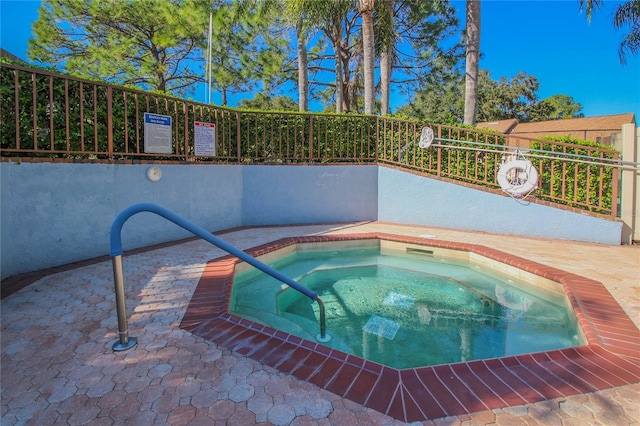 view of pool featuring a community hot tub