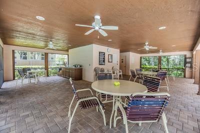 interior space with ceiling fan and wood ceiling