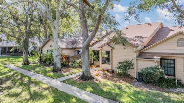 2582 Bentley Dr, Palm Harbor, FL 34684 - view of front of property featuring a front lawn and roof with shingles