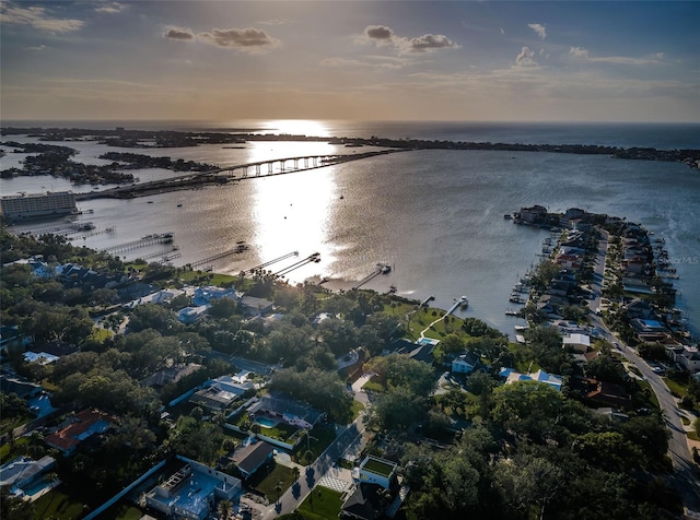 aerial view at dusk with a water view