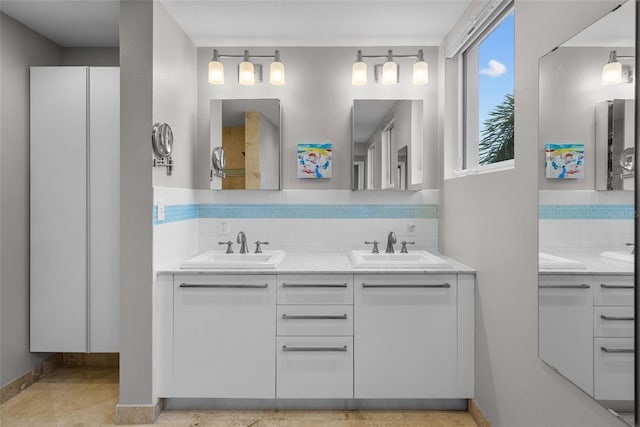 bathroom featuring vanity and backsplash