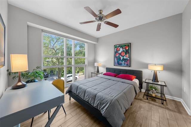 bedroom featuring ceiling fan and light wood-type flooring