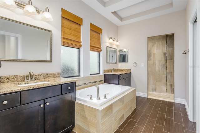 bathroom with vanity and plus walk in shower