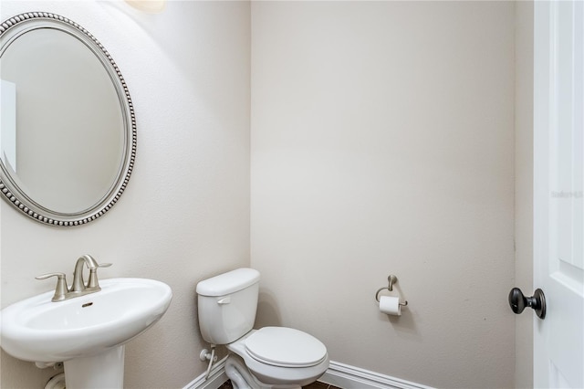 bathroom with toilet and sink