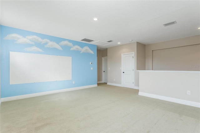 unfurnished room with light colored carpet