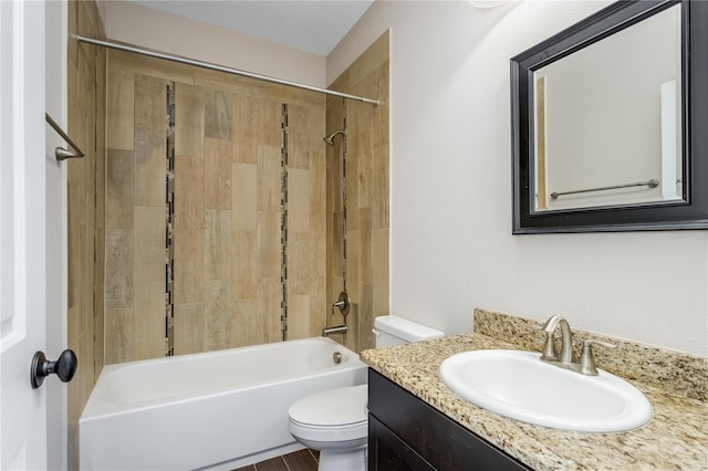 full bathroom with vanity, toilet, and tiled shower / bath