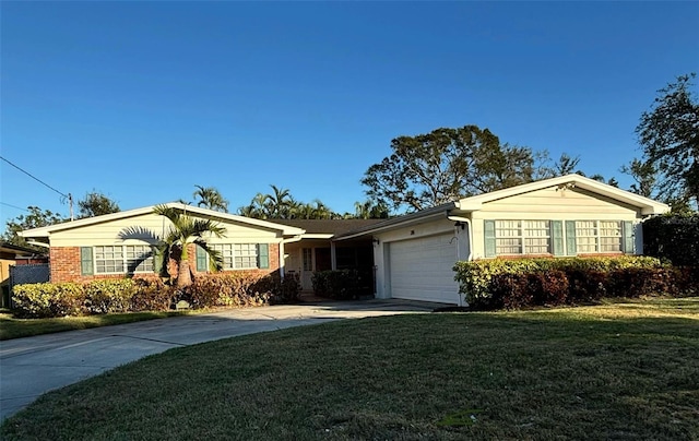 ranch-style home with a front yard and a garage