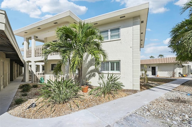 view of property exterior with a balcony