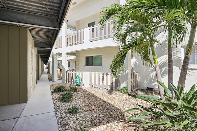 view of side of property featuring a balcony