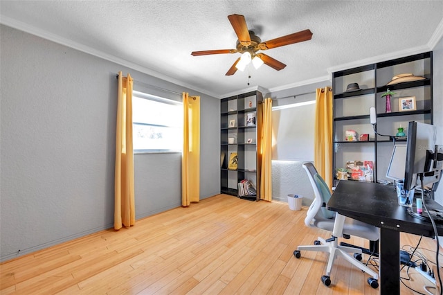 office with a textured ceiling, light wood-type flooring, ceiling fan, and ornamental molding