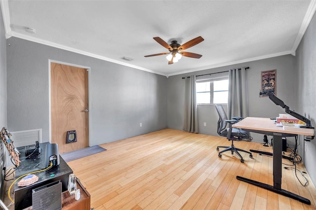 home office featuring ceiling fan, hardwood / wood-style floors, and ornamental molding