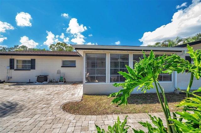 rear view of house with a patio area