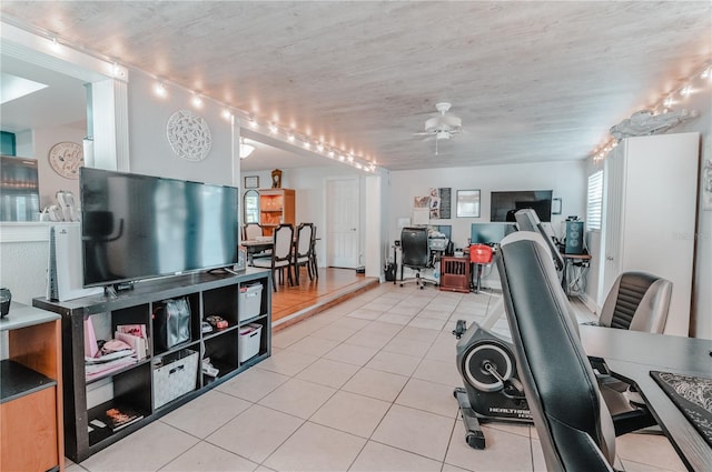 office space with ceiling fan and light tile patterned flooring