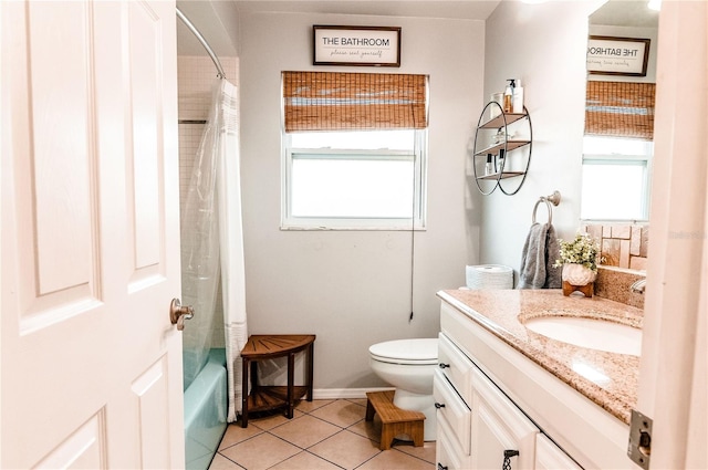 full bathroom featuring toilet, shower / bath combination with curtain, vanity, and tile patterned floors