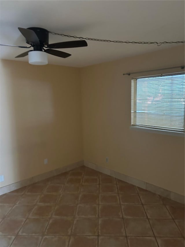 unfurnished room with tile patterned flooring and ceiling fan