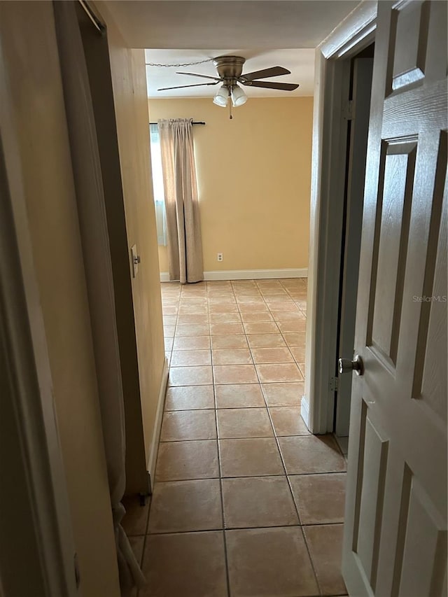 corridor with light tile patterned flooring