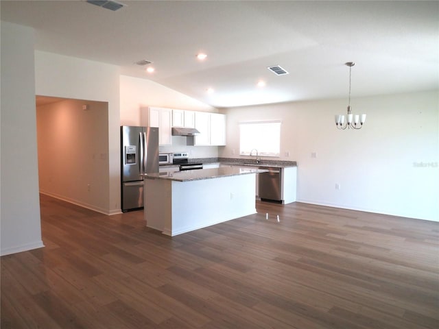 148 Summerlin Loop, Haines City, FL 33844 - kitchen with appliances with stainless steel finishes, a center island, under cabinet range hood, a chandelier, and white cabinets