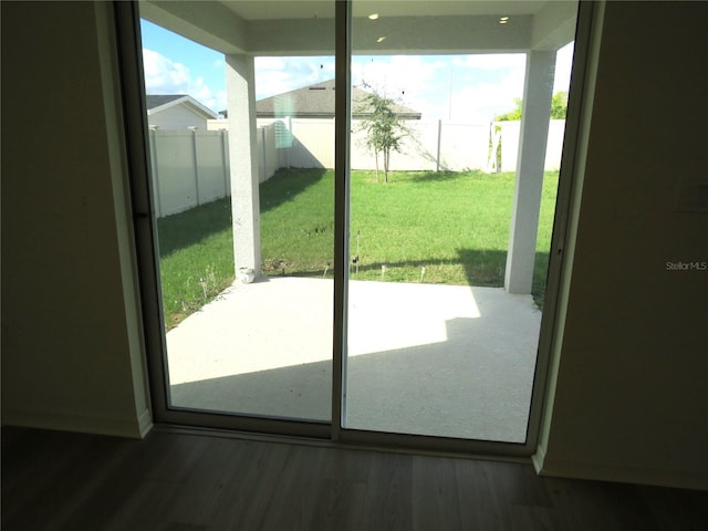 entryway with dark hardwood / wood-style floors