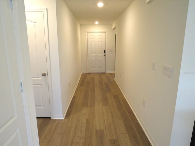 148 Summerlin Loop, Haines City, FL 33844 - corridor with light wood-type flooring, baseboards, and recessed lighting