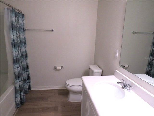 full bathroom featuring vanity, shower / bathtub combination with curtain, wood-type flooring, and toilet