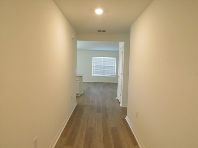 hall with light hardwood / wood-style floors