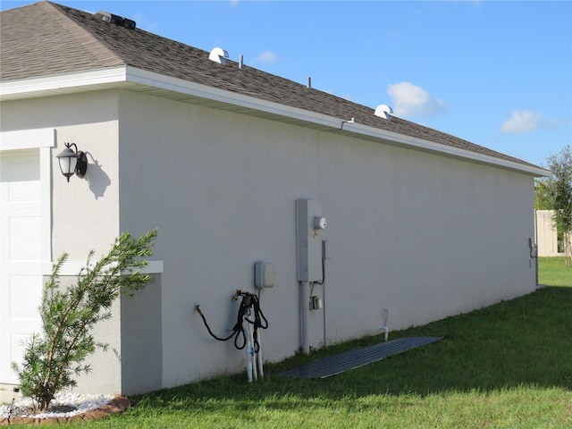 148 Summerlin Loop, Haines City, FL 33844 - view of property exterior featuring a yard, a garage, stucco siding, and roof with shingles
