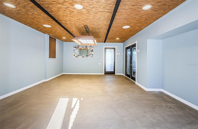 unfurnished room featuring wood ceiling