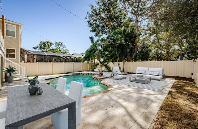 view of swimming pool with a patio and an outdoor hangout area