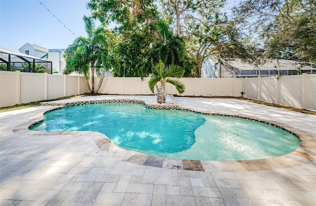 view of swimming pool featuring a patio area