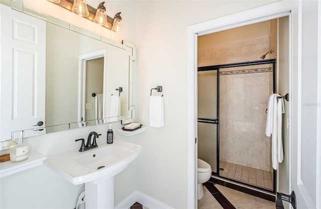 bathroom featuring an enclosed shower and toilet