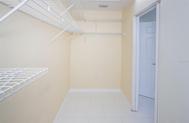 spacious closet with light tile patterned flooring