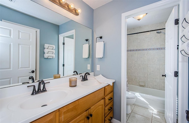 full bathroom featuring shower / tub combo with curtain, vanity, tile patterned floors, and toilet