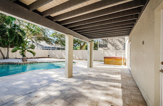 view of patio with a pool with hot tub