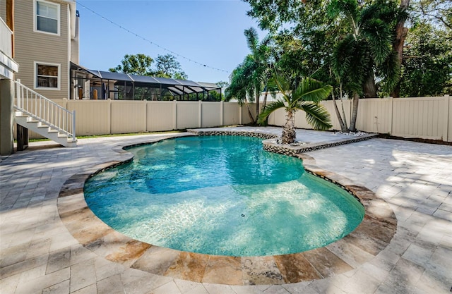 view of pool featuring a patio and a lanai