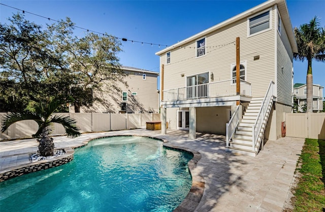 view of pool with a patio and french doors