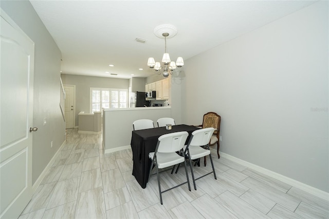 dining area featuring a chandelier