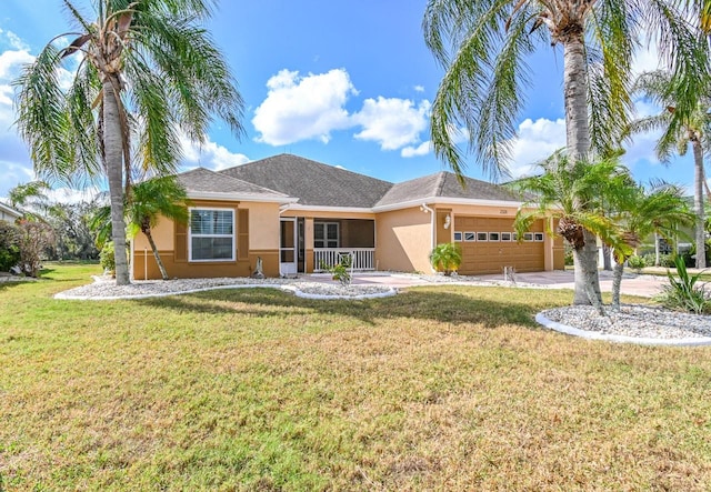 ranch-style home with a front lawn and a garage