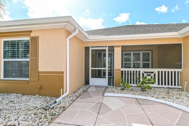 entrance to property with a patio