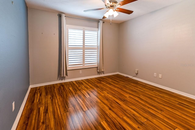 empty room featuring ceiling fan, wood-type flooring, and a textured ceiling